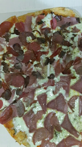 EL RASTA ENTRE PIZZAS Y BRASAS